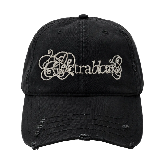 Black distressed baseball cap with decorative text on a white background